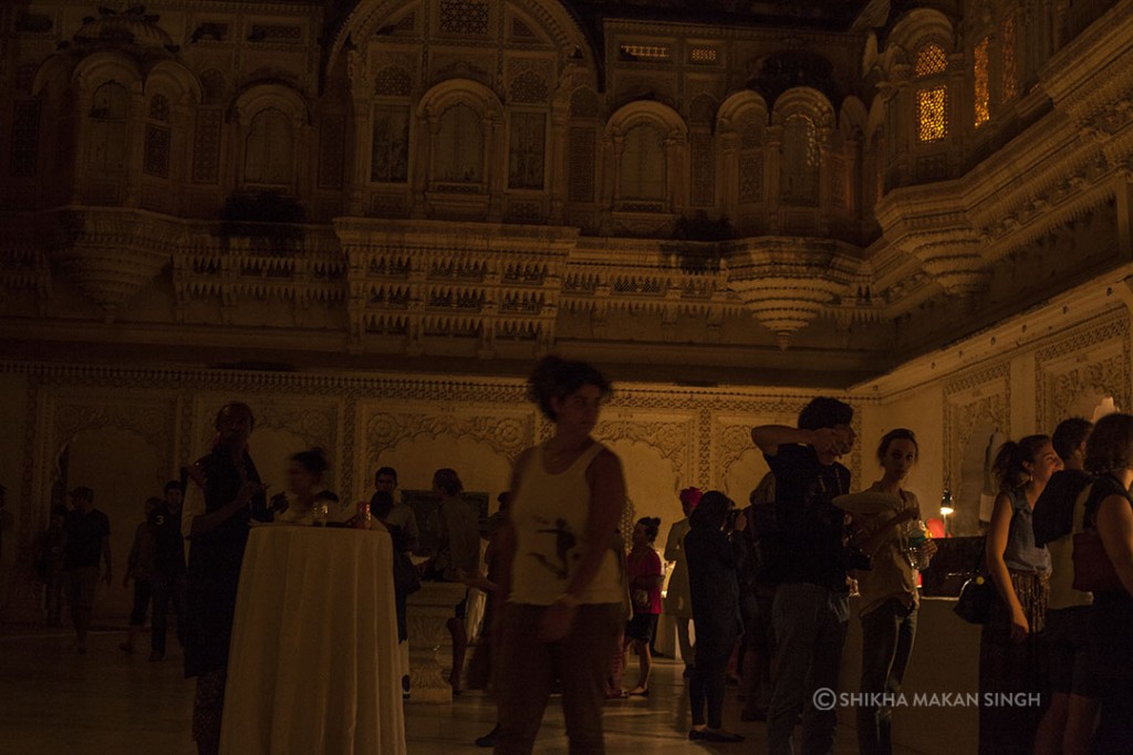 The guests enjoy food and drinks during breaks, inside the royal courts.