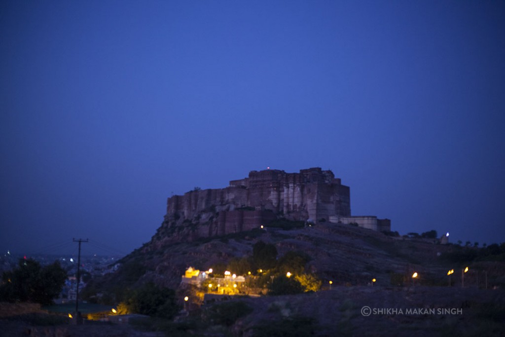 In the wee hours of the morning the tall fort dazzles against the deep blue skies.