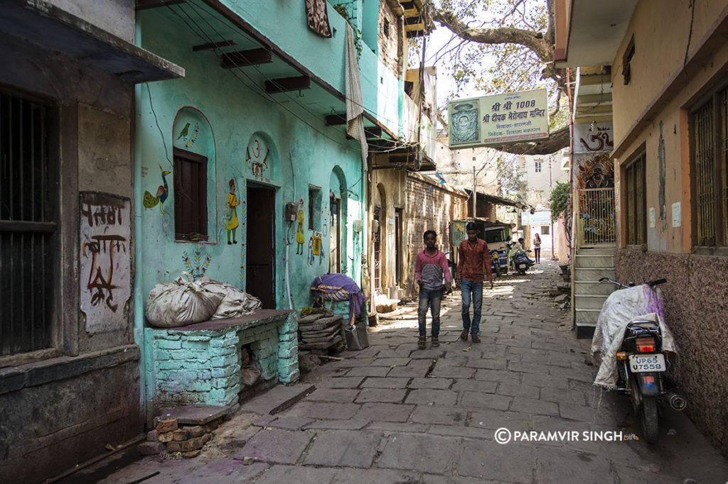 Art on a green painted building in Benaras.